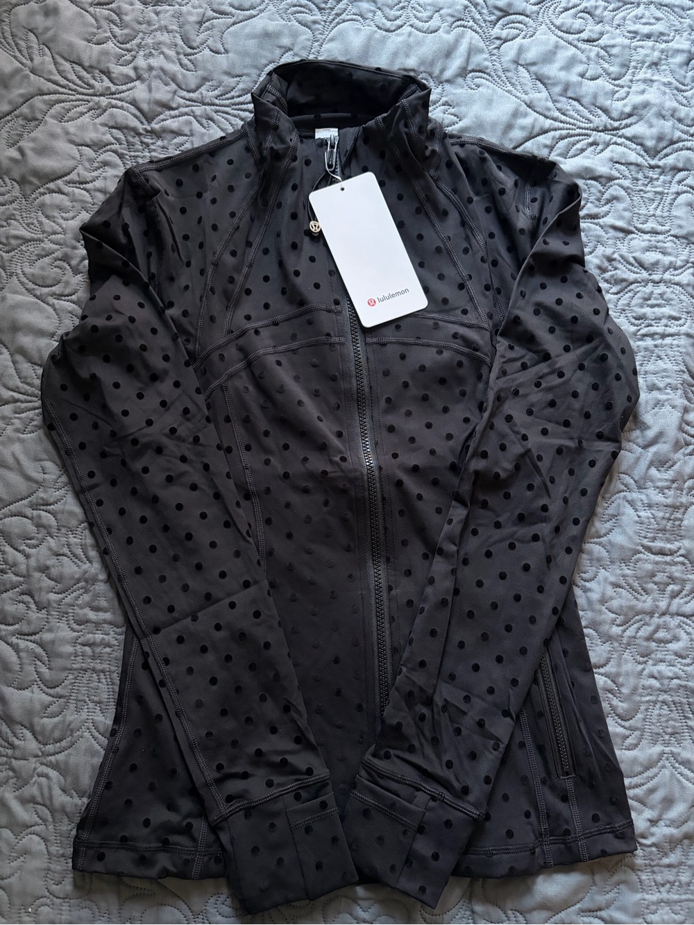 Define lululemon jacket in black with polka dots